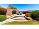 Secluded backyard patio with lounge chairs, lush greenery, and privacy walls at 16211 S 4Th St, Phoenix, AZ 85048