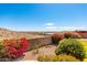 Scenic backyard view overlooking the desert landscape, flowers, and neighborhood homes at 16211 S 4Th St, Phoenix, AZ 85048