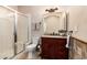 Bathroom with glass enclosed shower, granite vanity, and decorative wall tile at 16211 S 4Th St, Phoenix, AZ 85048