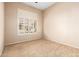Bedroom with carpeted floor and shuttered window allowing natural light at 16211 S 4Th St, Phoenix, AZ 85048