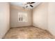 Neutral bedroom with tile floor, ceiling fan, and plantation shutters at 16211 S 4Th St, Phoenix, AZ 85048