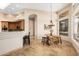Bright dining area includes chandelier lighting and kitchen access at 16211 S 4Th St, Phoenix, AZ 85048