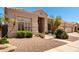 Inviting home with a three-car garage, manicured landscaping, and a tile roof at 16211 S 4Th St, Phoenix, AZ 85048