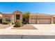 Charming home featuring a well-maintained yard, complemented by a three-car garage and a tile roof at 16211 S 4Th St, Phoenix, AZ 85048