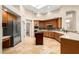 Spacious kitchen featuring stainless steel appliances, tile backsplash, and a center island at 16211 S 4Th St, Phoenix, AZ 85048