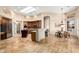 Open-concept kitchen featuring a center island, breakfast nook, and stainless steel appliances at 16211 S 4Th St, Phoenix, AZ 85048