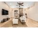 Warm living room offers a stone fireplace, tiled floors, ceiling fan, and comfortable seating at 16211 S 4Th St, Phoenix, AZ 85048