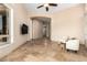 Spacious living room featuring tile floors, recessed lighting, and ample natural light at 16211 S 4Th St, Phoenix, AZ 85048