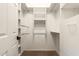 Spacious walk-in closet with extensive built-in shelving and rods at 16211 S 4Th St, Phoenix, AZ 85048