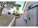 Side yard with desert landscaping, walkway and exterior of the home at 16304 E Crystal Ridge Dr, Fountain Hills, AZ 85268