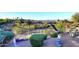 Desert landscaped backyard featuring a soaring eagle statue and mature plants, trees and shrubs at 16304 E Crystal Ridge Dr, Fountain Hills, AZ 85268