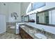 Elegant bathroom featuring dual sinks, granite countertops, and a soaking tub for ultimate relaxation at 16304 E Crystal Ridge Dr, Fountain Hills, AZ 85268