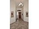 Foyer with decorative niches, tile flooring, stylish lighting and an impressive wood front door at 16304 E Crystal Ridge Dr, Fountain Hills, AZ 85268