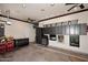 Spacious garage with ample storage cabinets, ceiling fans, and work bench at 16304 E Crystal Ridge Dr, Fountain Hills, AZ 85268