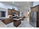 Spacious kitchen with stainless steel appliances, breakfast bar, and seamless flow to living areas at 16304 E Crystal Ridge Dr, Fountain Hills, AZ 85268