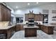 Gourmet kitchen boasts custom cabinets, granite counters, and a central island for cooking and entertaining at 16304 E Crystal Ridge Dr, Fountain Hills, AZ 85268