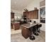 Charming kitchen featuring a central island, dark wood cabinets and recessed lighting at 16304 E Crystal Ridge Dr, Fountain Hills, AZ 85268
