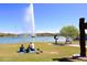 Picturesque lakeside park with a large fountain and Gathering relaxing on the grass at 16304 E Crystal Ridge Dr, Fountain Hills, AZ 85268