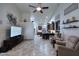Open-concept living room with high ceilings, neutral tones, and seamlessly connected kitchen at 16304 E Crystal Ridge Dr, Fountain Hills, AZ 85268