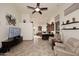 Bright living room seamlessly connects to a well-equipped kitchen with bar seating at 16304 E Crystal Ridge Dr, Fountain Hills, AZ 85268