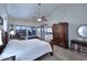 Serene main bedroom with high ceilings, views, and private access to balcony at 16304 E Crystal Ridge Dr, Fountain Hills, AZ 85268