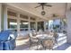 A covered patio with an outdoor kitchen, ceiling fans, and decorative accents at 16304 E Crystal Ridge Dr, Fountain Hills, AZ 85268