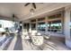 Covered patio featuring tile flooring, ceiling fans, and comfortable seating area at 16304 E Crystal Ridge Dr, Fountain Hills, AZ 85268