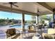 Covered patio with an outdoor kitchen, ceiling fans, comfortable seating area and a pool view at 16304 E Crystal Ridge Dr, Fountain Hills, AZ 85268