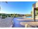The brick pool deck has desert landscaping and lush greenery with beautiful pool view at 16304 E Crystal Ridge Dr, Fountain Hills, AZ 85268