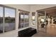 Bright sitting area featuring plush ottomans, large windows, and a sliding door to the patio at 16304 E Crystal Ridge Dr, Fountain Hills, AZ 85268