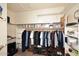 Walk-in closet with rods, shelves, and storage containers at 16304 E Crystal Ridge Dr, Fountain Hills, AZ 85268