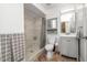Clean bathroom featuring tiled shower with a glass door, modern vanity, and neutral color scheme at 1633 E Lakeside Dr # 139, Gilbert, AZ 85234