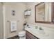 Well-lit bathroom featuring a large vanity, sink, mirror, towel rack, and decorative wall art at 1633 E Lakeside Dr # 139, Gilbert, AZ 85234
