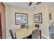 Dining area with tan walls, artwork, ceiling fan and seating for four at 1633 E Lakeside Dr # 139, Gilbert, AZ 85234