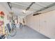 Spacious garage with built-in cabinets for storage, a gray epoxy floor and overhead lighting at 1633 E Lakeside Dr # 139, Gilbert, AZ 85234
