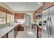 Modern kitchen with stainless steel appliances, tiled backsplash, and ample cabinet space at 1633 E Lakeside Dr # 139, Gilbert, AZ 85234