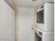 Functional laundry area with stacked washer and dryer, and built-in storage for efficient space utilization at 1633 E Lakeside Dr # 139, Gilbert, AZ 85234