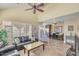Spacious living room with high ceilings, tile flooring, and comfortable seating arrangement at 1633 E Lakeside Dr # 139, Gilbert, AZ 85234