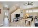 Open concept living area with high ceilings, neutral colors, and access to the stairway at 1633 E Lakeside Dr # 139, Gilbert, AZ 85234