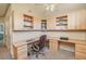 Spacious home office with built-in shelving, a large corner desk, and ample natural light at 1633 E Lakeside Dr # 139, Gilbert, AZ 85234