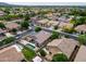 Overhead view of homes with pools, manicured lawns, and patio areas in a desirable neighborhood at 16861 W Ironwood St, Surprise, AZ 85388