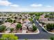 Expansive aerial view of a suburban neighborhood with well-maintained homes and desert landscaping under a sunny sky at 16861 W Ironwood St, Surprise, AZ 85388