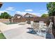 Spacious backyard featuring a patio, in ground pool, lounge chairs, and lovely exterior lighting at 16861 W Ironwood St, Surprise, AZ 85388