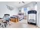 Bright bedroom with neutral walls, a ceiling fan, and a cozy bed at 16861 W Ironwood St, Surprise, AZ 85388