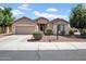 Charming single-story home with a two-car garage, low maintenance yard, and covered porch at 16861 W Ironwood St, Surprise, AZ 85388