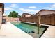 An inviting in-ground pool surrounded by concrete decking, perfect for summer relaxation and entertainment at 16861 W Ironwood St, Surprise, AZ 85388