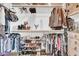Well-organized walk-in closet with shelves, hanging rods, and ample storage space for clothes and shoes at 16861 W Ironwood St, Surprise, AZ 85388