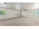 Spacious bonus room with neutral carpet and several windows allowing natural light at 2018 E Avenida Del Sol --, Phoenix, AZ 85024
