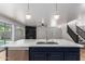 Bright, open kitchen featuring a large island with quartz countertops and modern stainless steel appliances at 2018 E Avenida Del Sol --, Phoenix, AZ 85024
