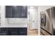 Kitchen featuring stainless steel appliances, black cabinets, and bright countertops for a modern design at 2018 E Avenida Del Sol --, Phoenix, AZ 85024